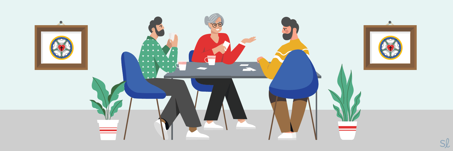 Three people sitting at a table in a Lutheran senior living facility