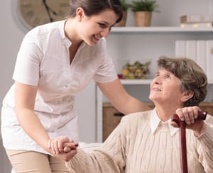 Nurse helping an older woman