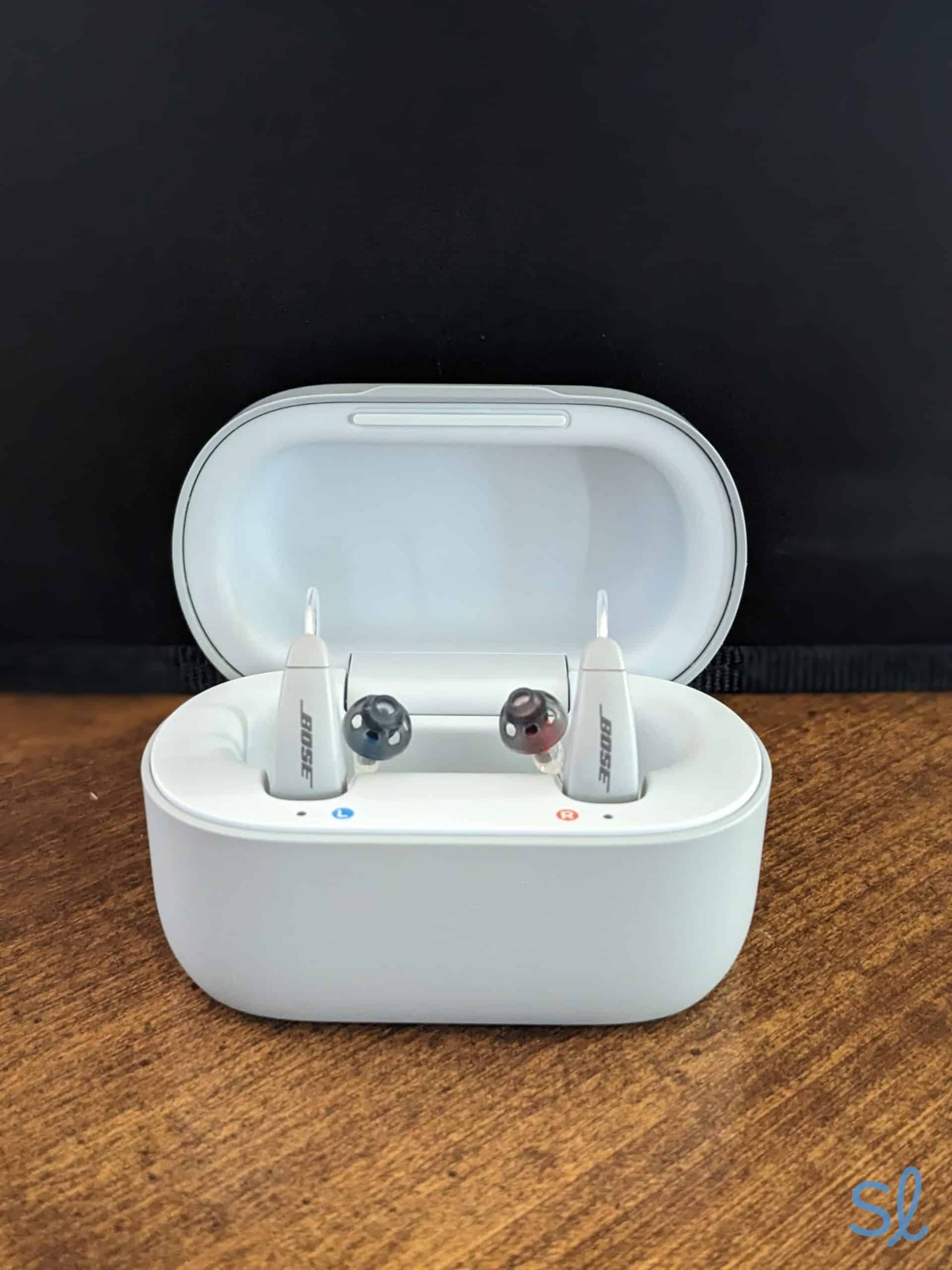 Lexie B2 hearing aids sitting in their charging case. 