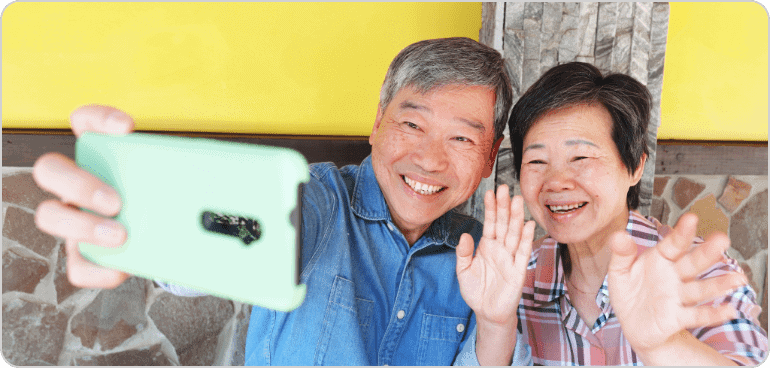 Older couple taking a cell with a phone
