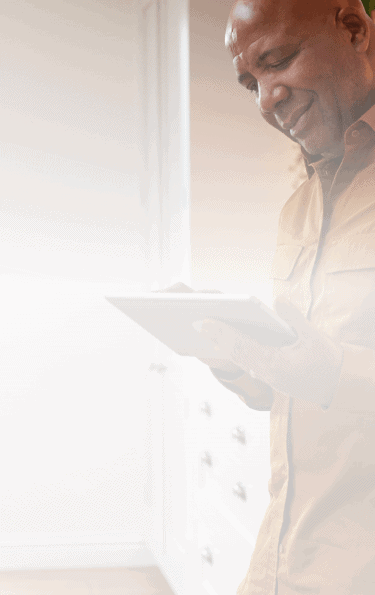 A man looking at a tablet