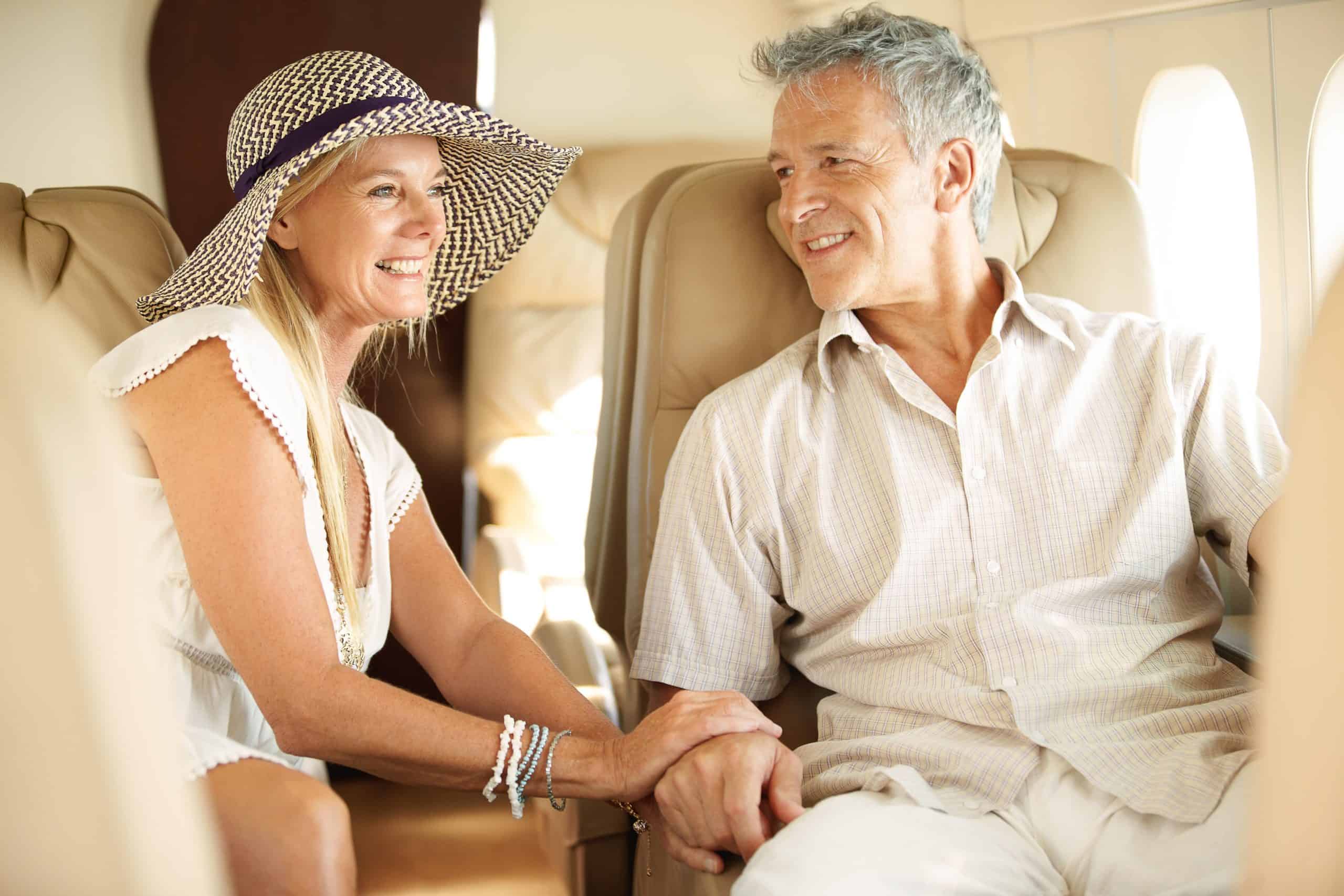 Happy couple on a plane