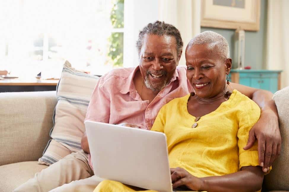 A couple looking at a laptop