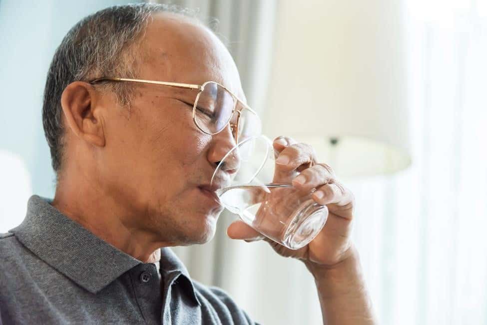 A man drinking water