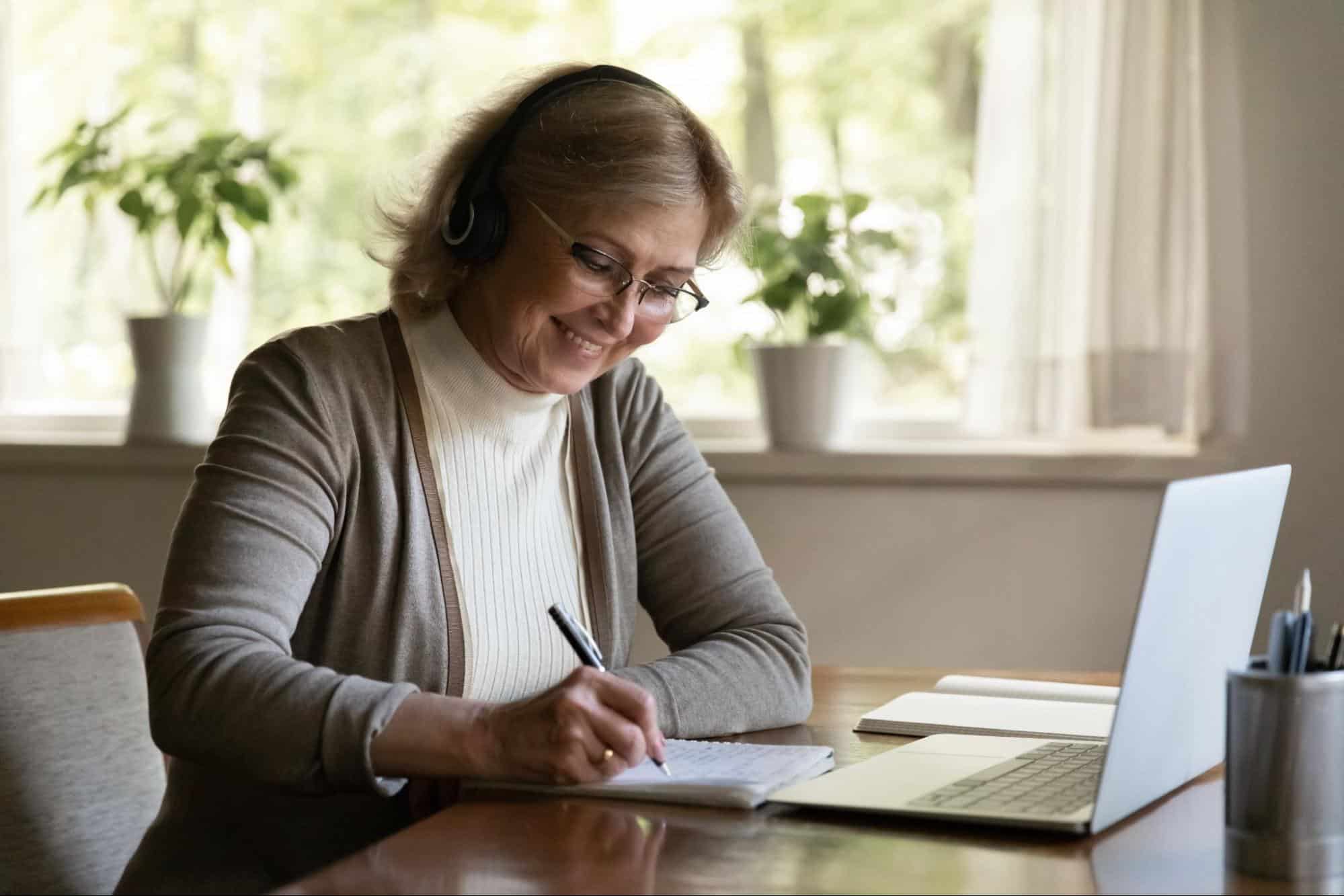 A woman writing in a notebook