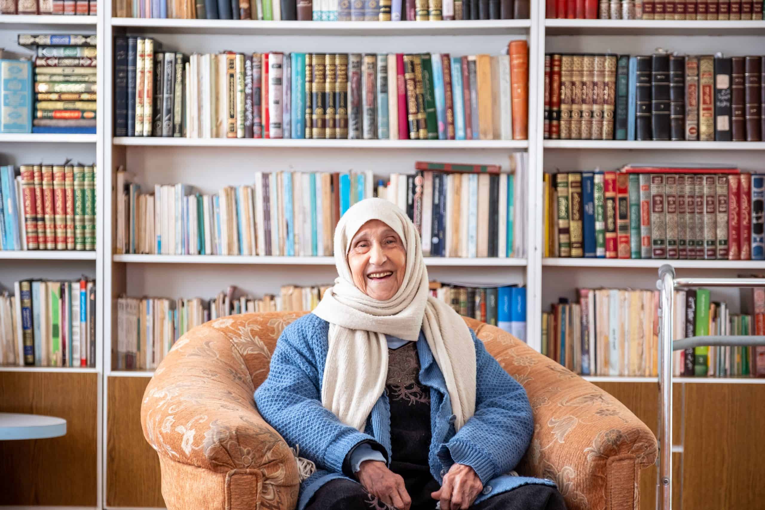 Older woman sitting in a library