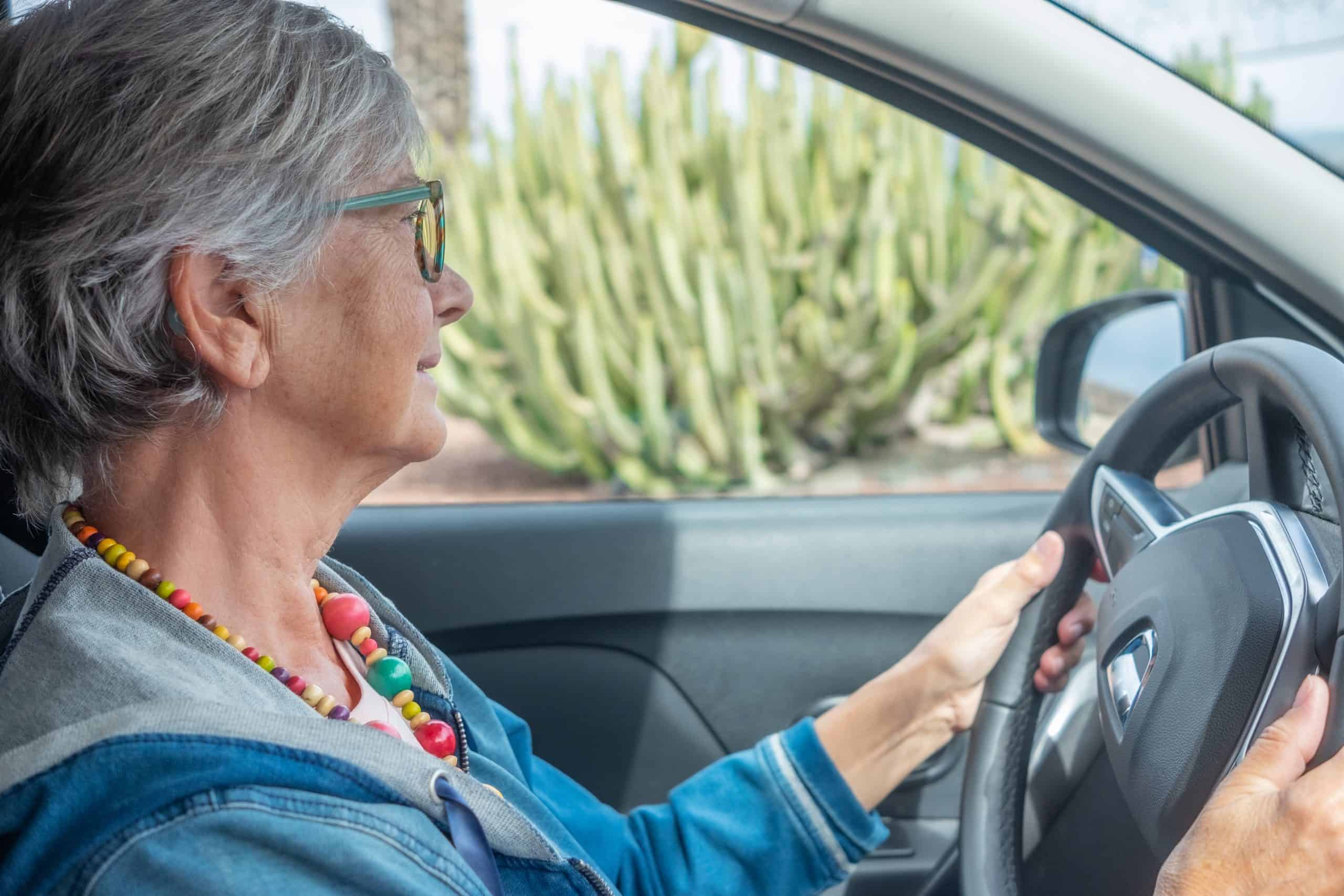 Senior women driving a car