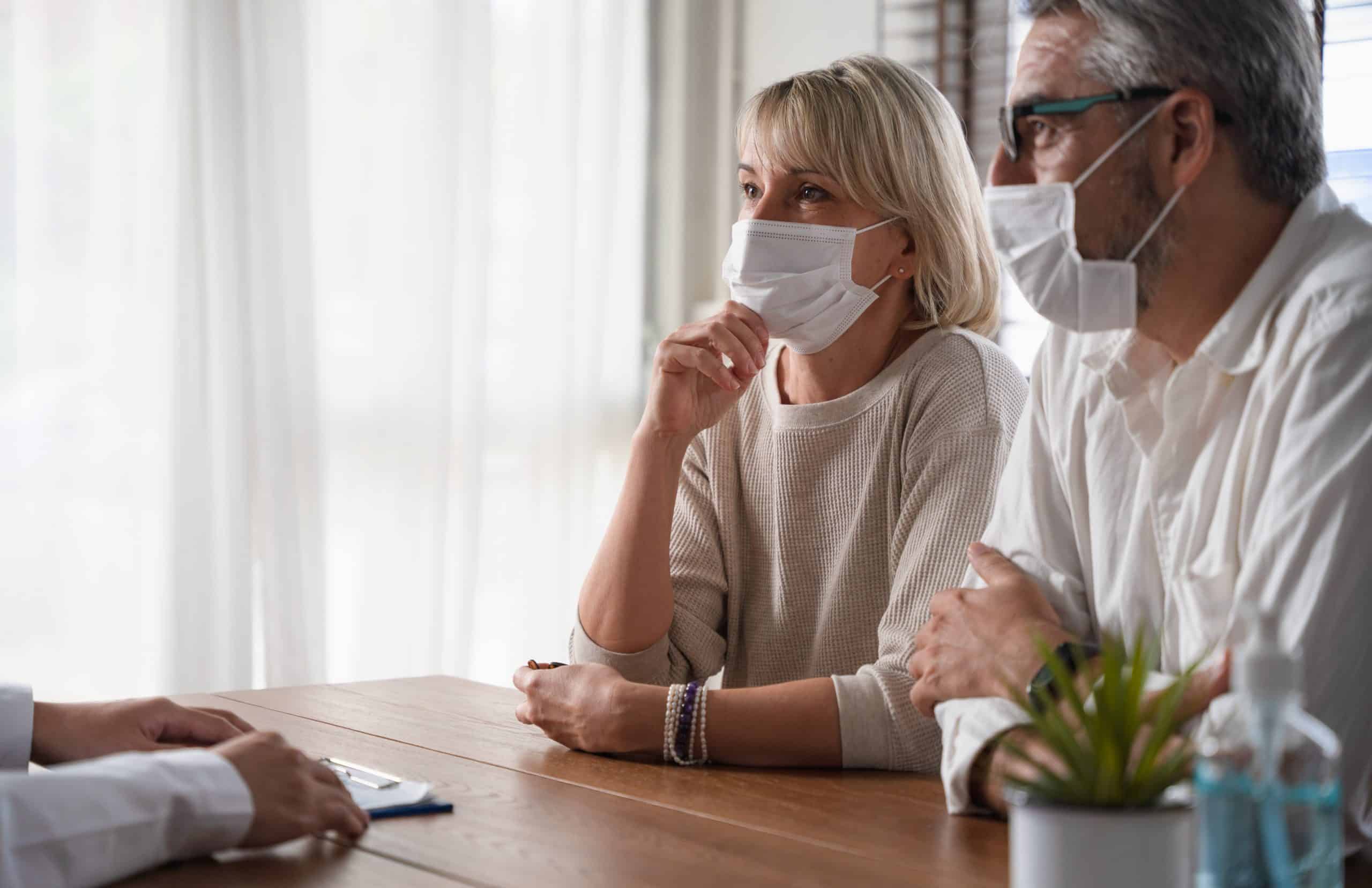 Elderly couple wearing face masks