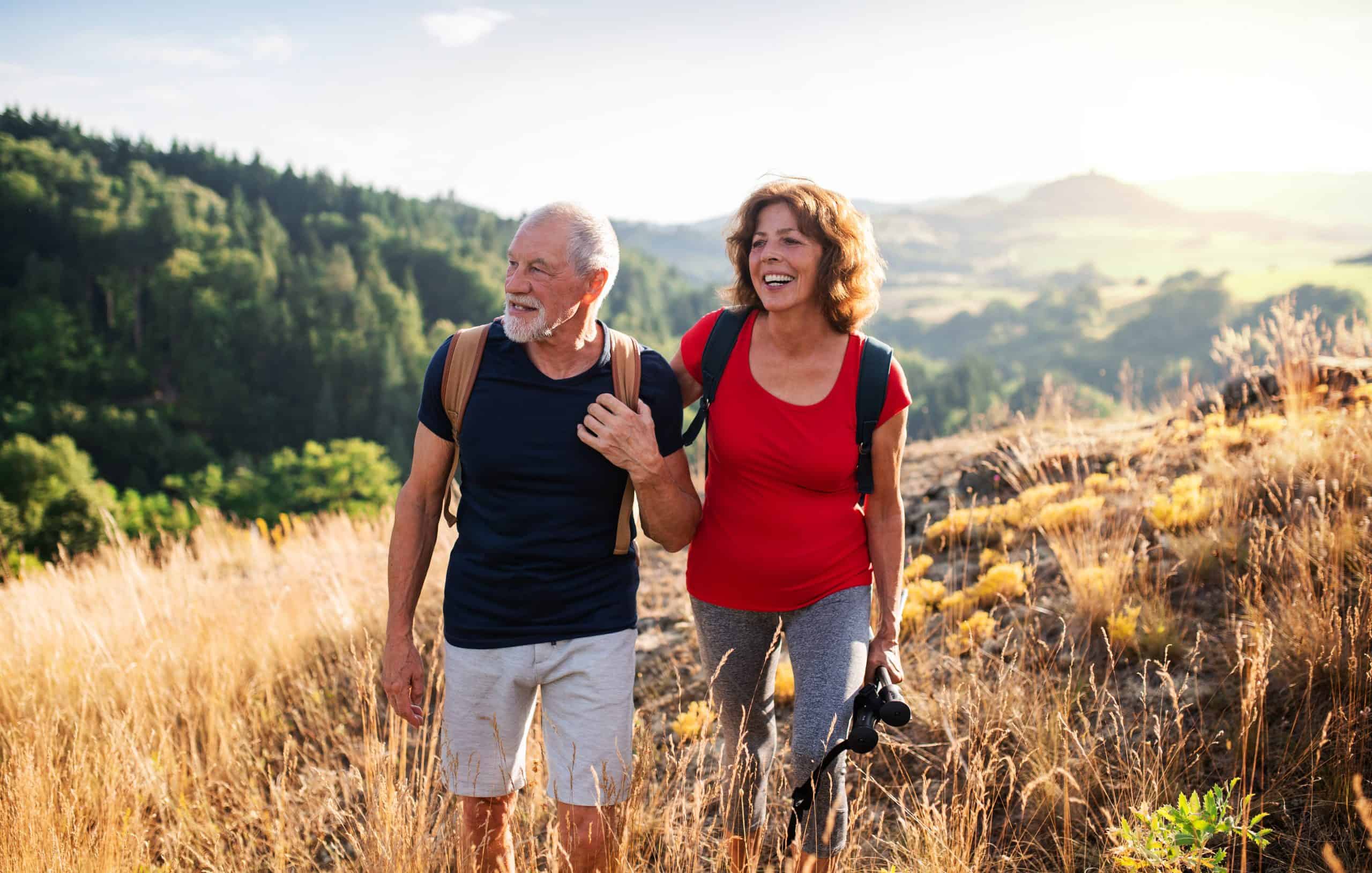 Couple walking through a field