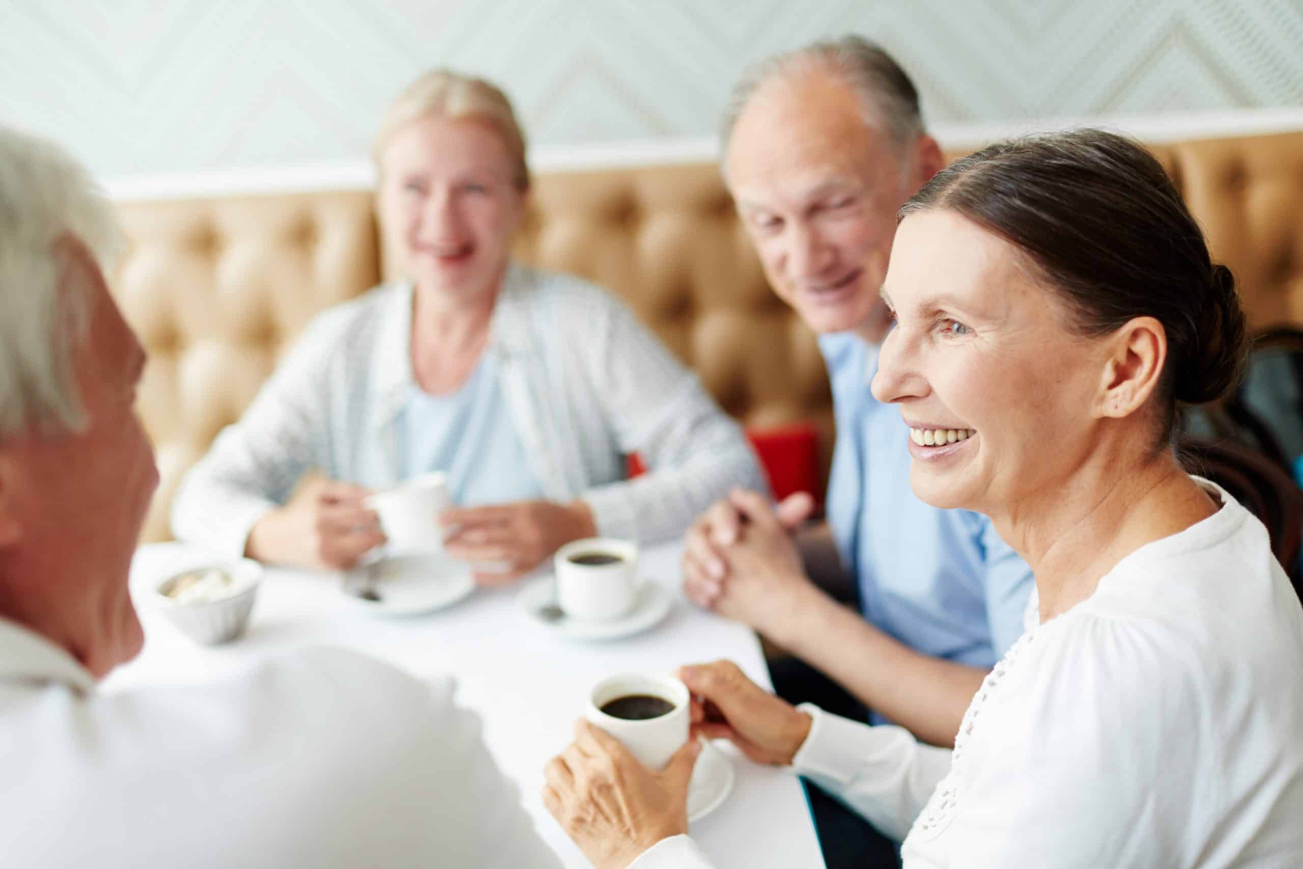 A group of people drinking coffee