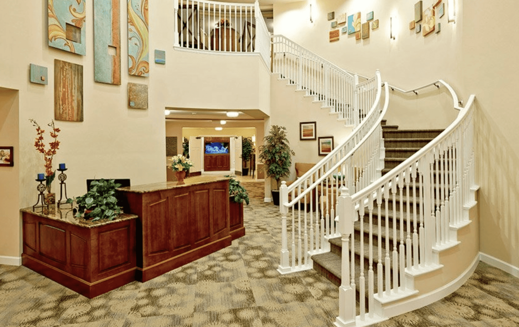 An interior staircase and reception area at MorningStar Assisted Living & Memory Care at Mountain Shadows