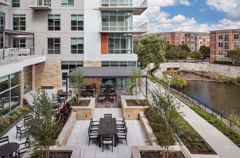 A view of the Village at the Triangle’s high-rise apartments and outdoor dining area.