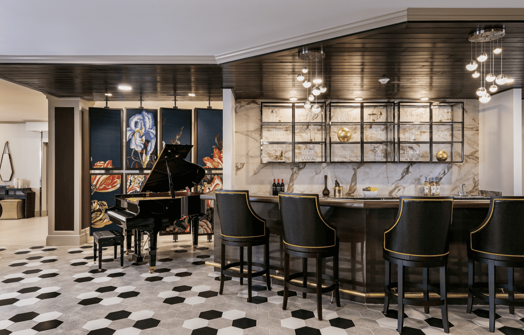 A bar and grand piano lounge at the Harborchase of Germantown.
