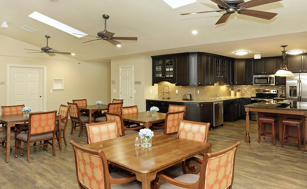 A kitchen and dining area at Meadowthorpe Assisted Living and Memory Care.